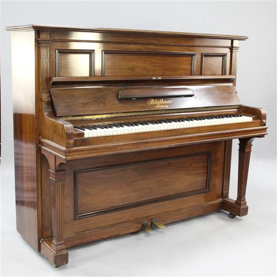 An early 20th century Bluthner rosewood cased upright piano,